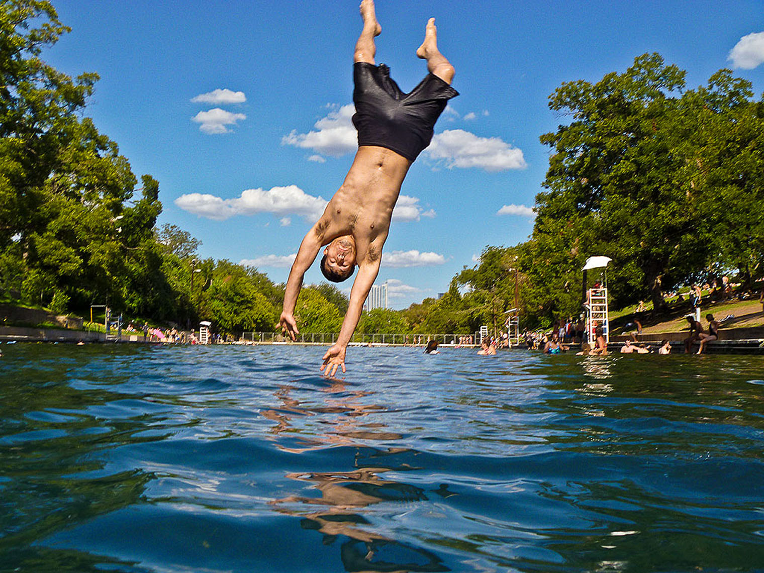 1149Barton Springs, Spring fed pool, boy diving, water surface reflection